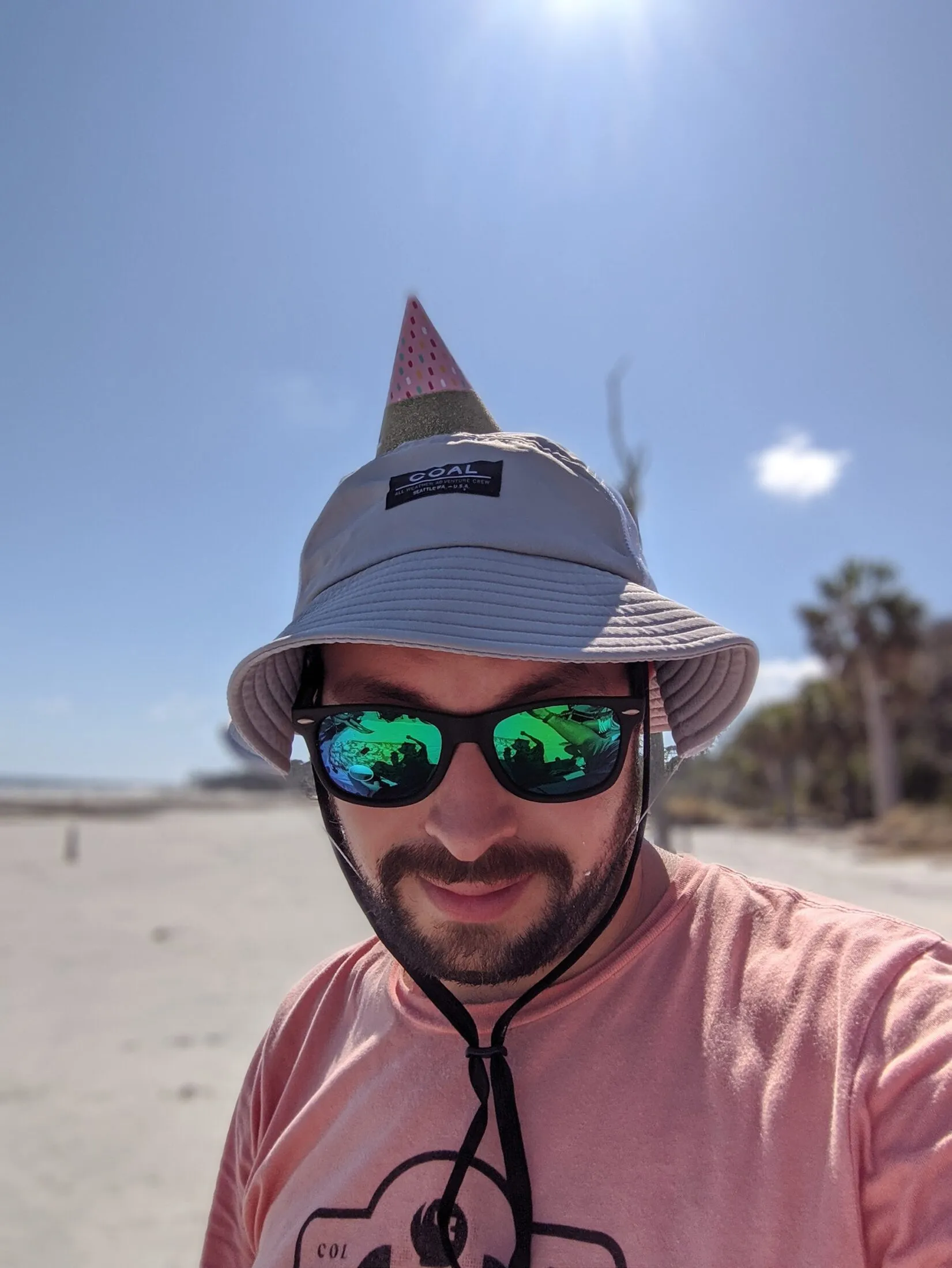 Me with a tiny party hat on top of my bucket hat.
