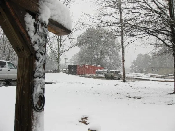A mailbox with 926 covered in snow.