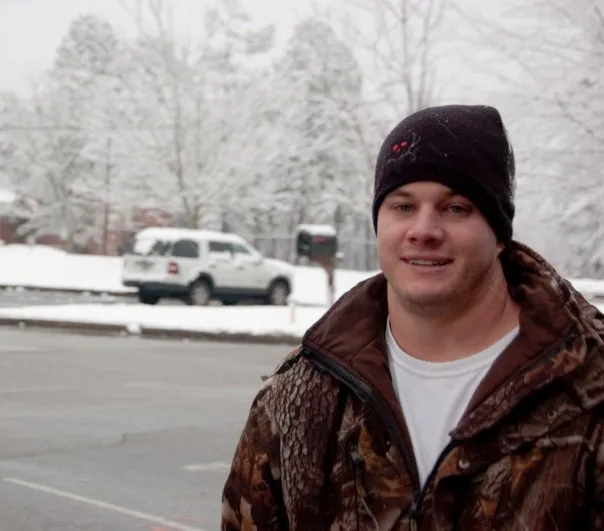 Mackey poses in the parking lot.