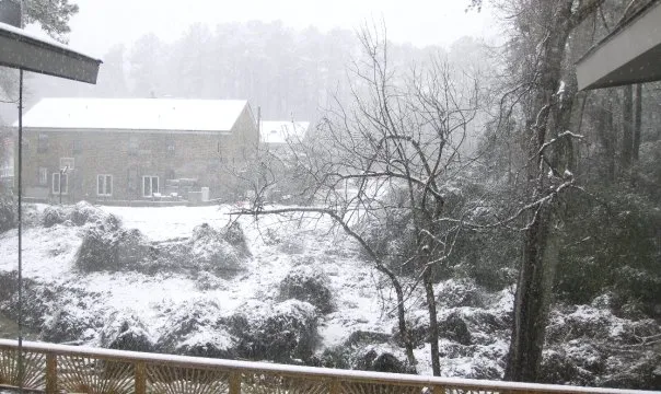 View across the creek in the snow.