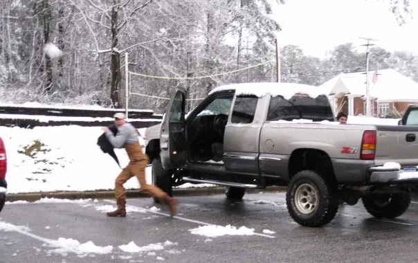 Chad tries to dodge snowballs after leaving his truck.