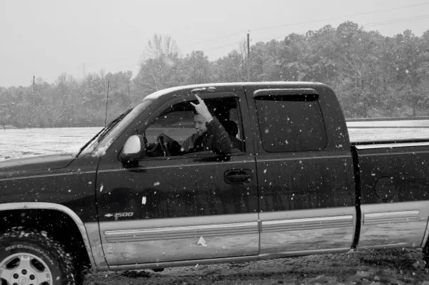 Hand signals while driving a truck in the snow.