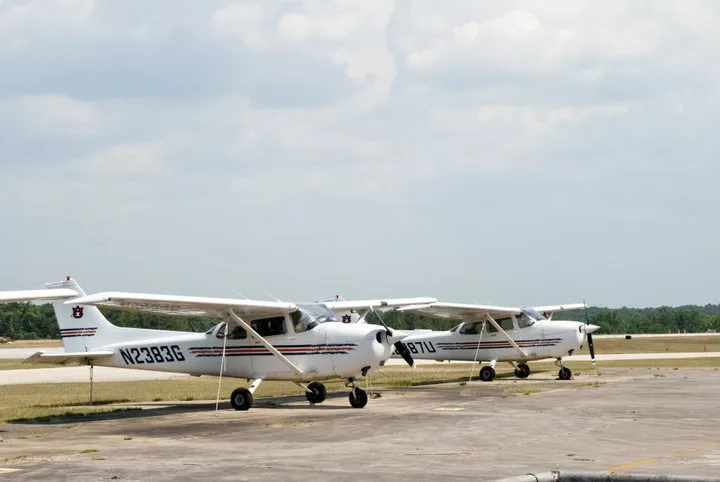 Two small prop planes side-by-side.