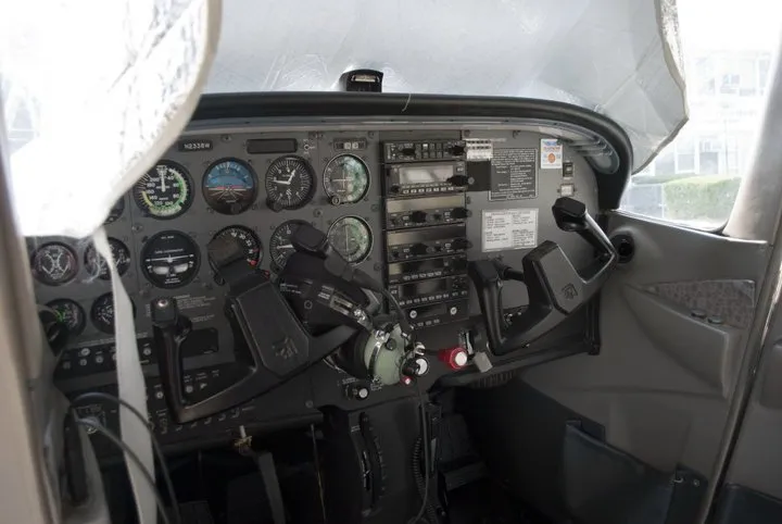 Controls inside the cockpit of a small plane.