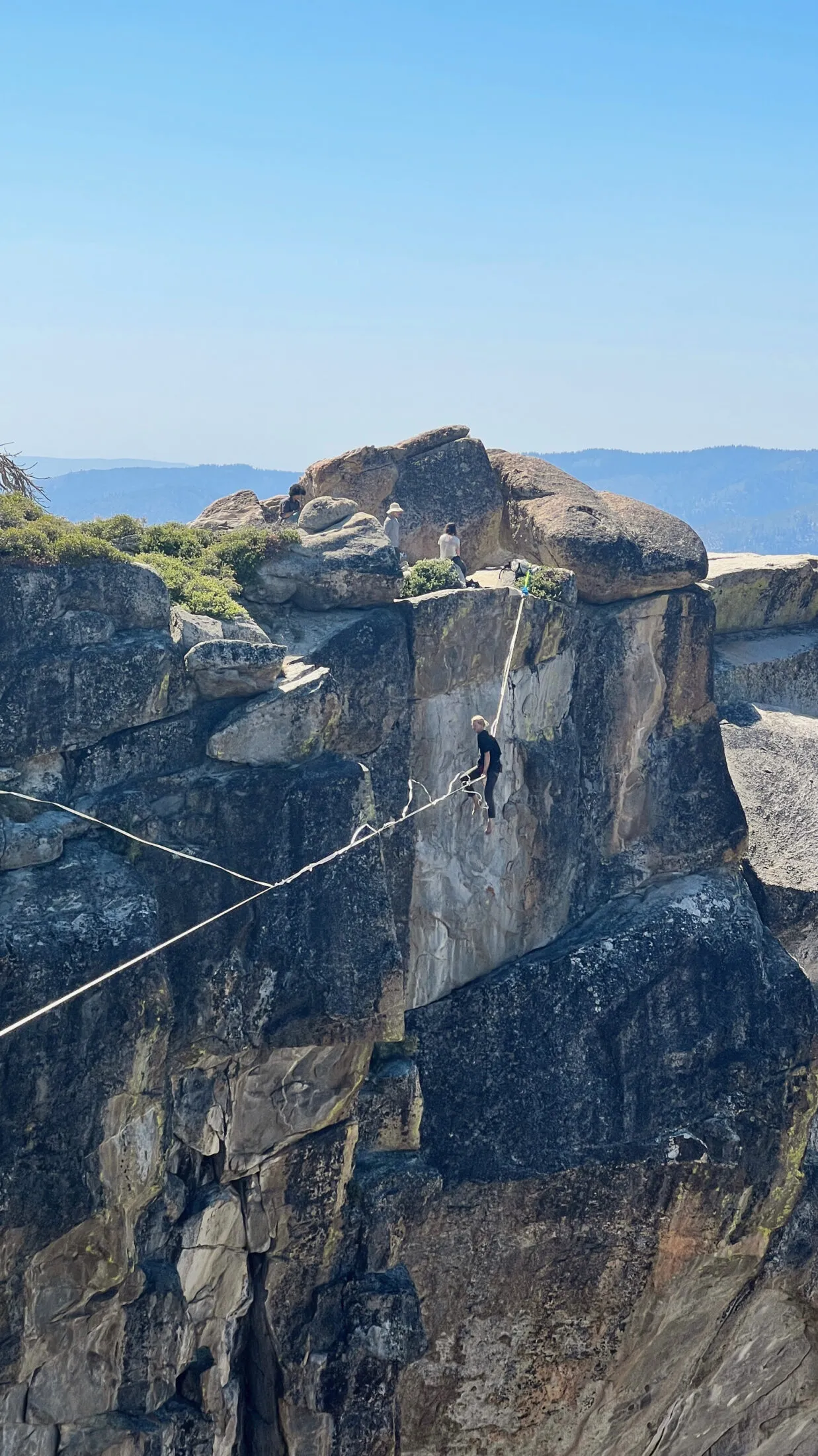Someone walking a slackline at Taft Point.