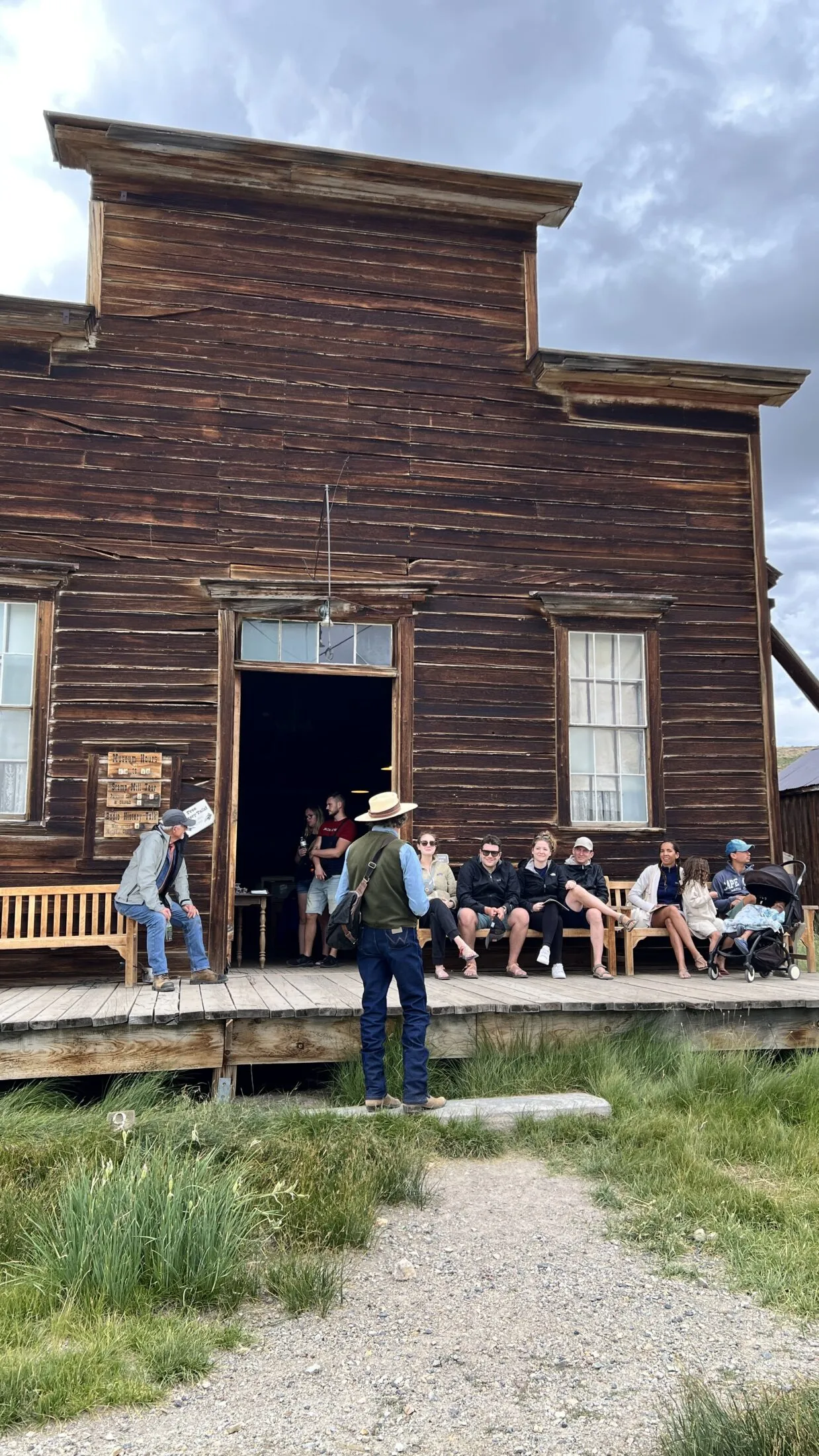 A ranger outside the general store tells stories about the old ghost town.