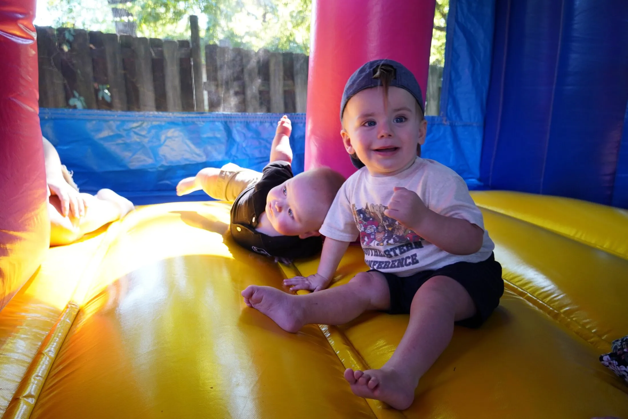 Henry and Wyatt playing in the bounce house.