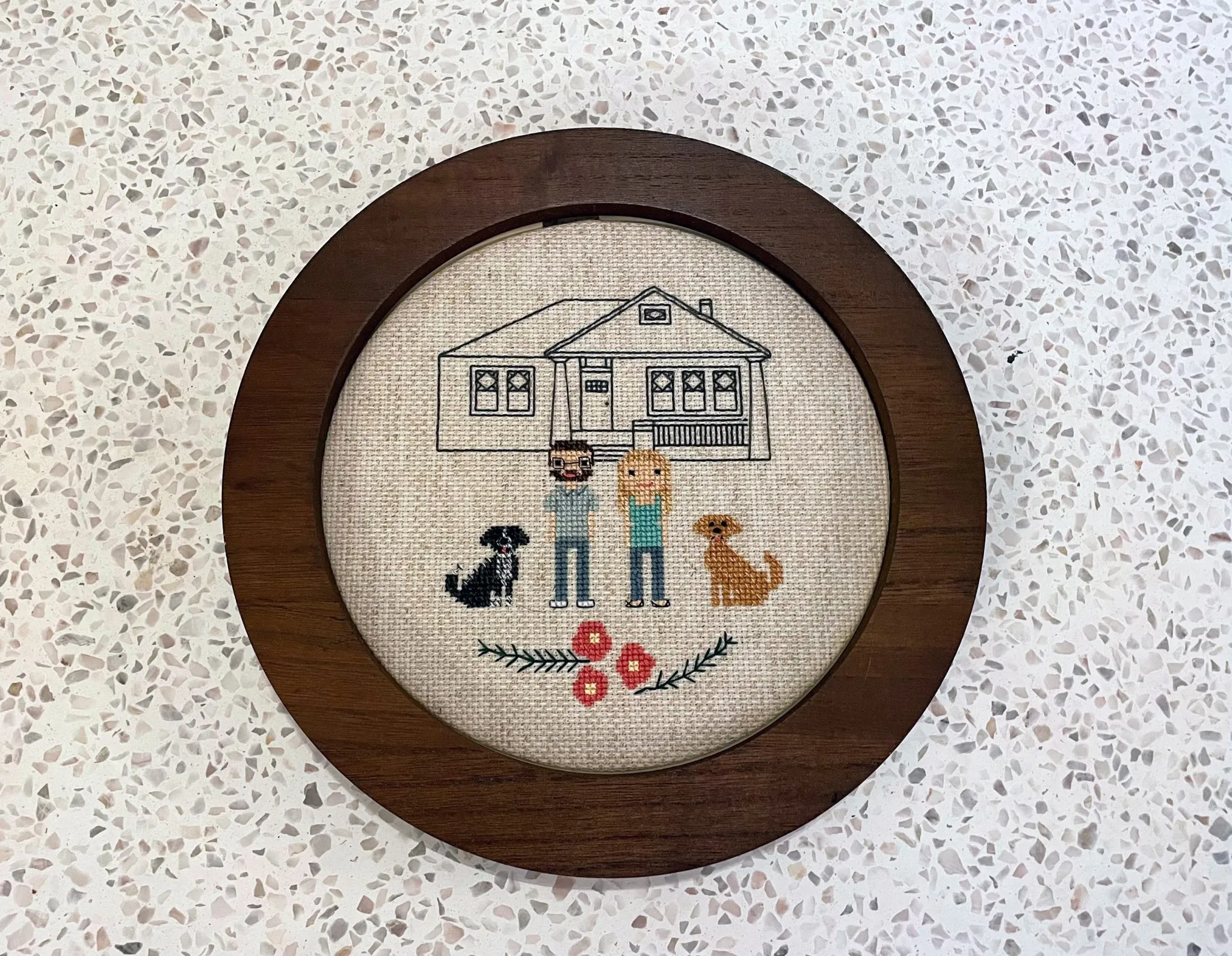 A cross-stitch with Otto, Sam, Holly and Remi.