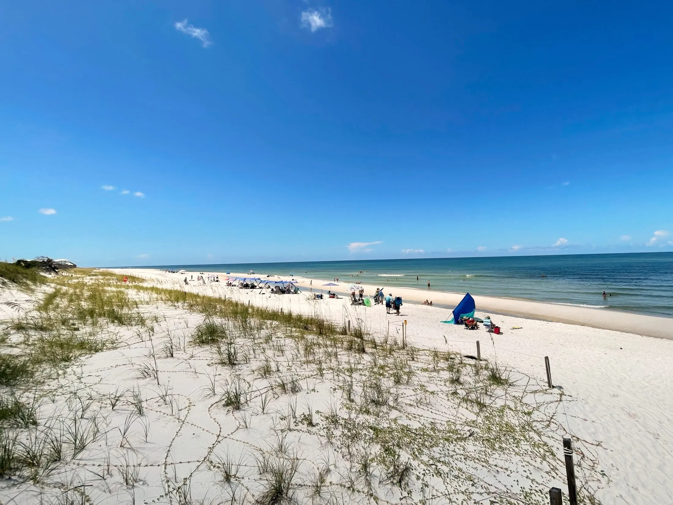 Beach dunes to the left of the entrance.