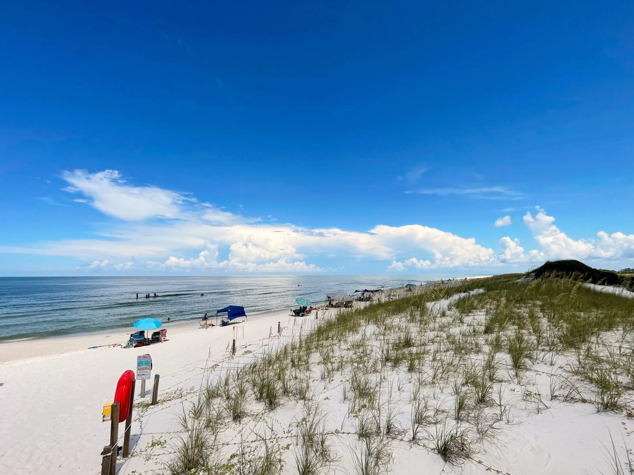 Beach dunes to the right of the entrance.