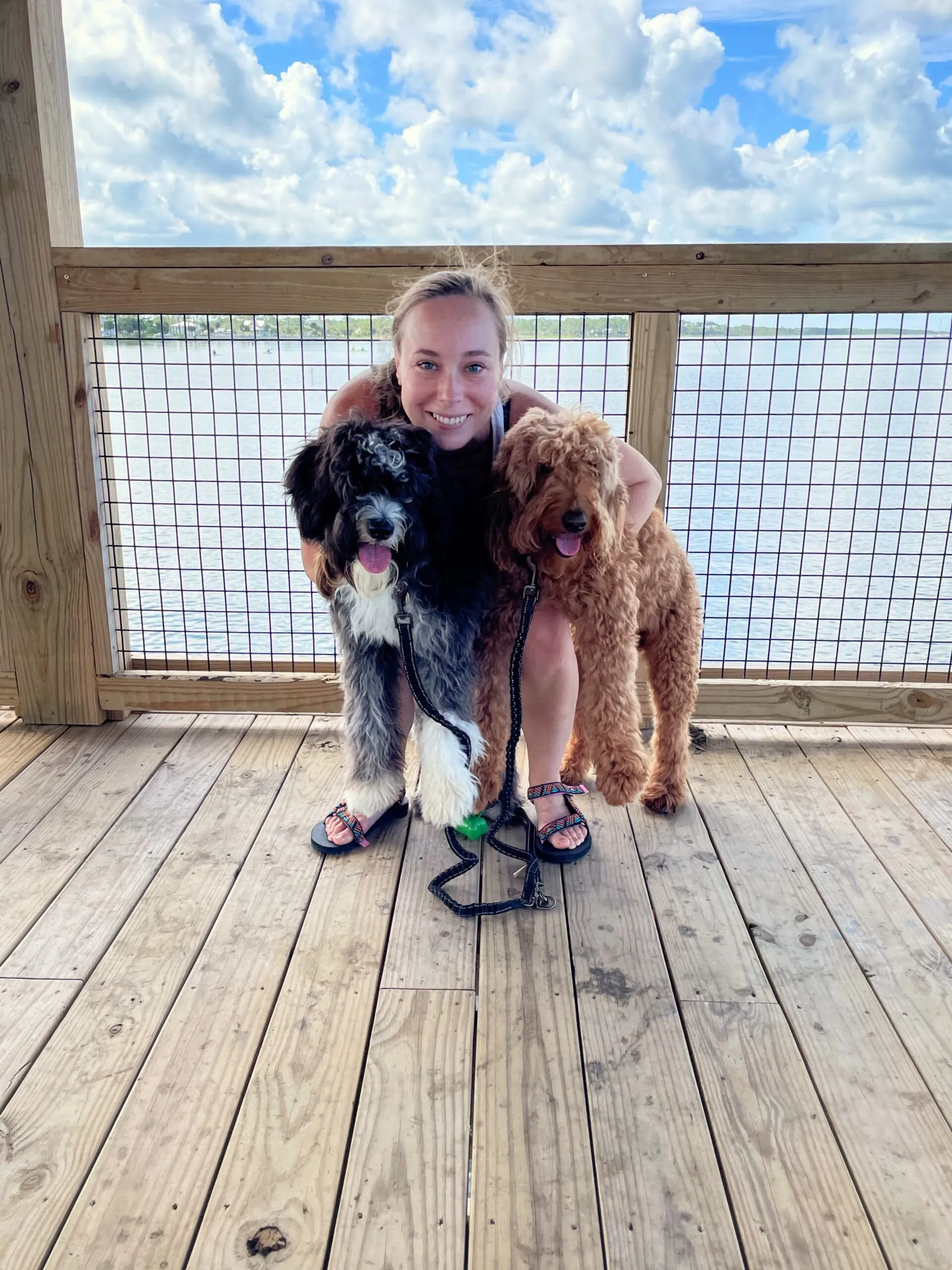 Holly squeezes Otto and Remi.