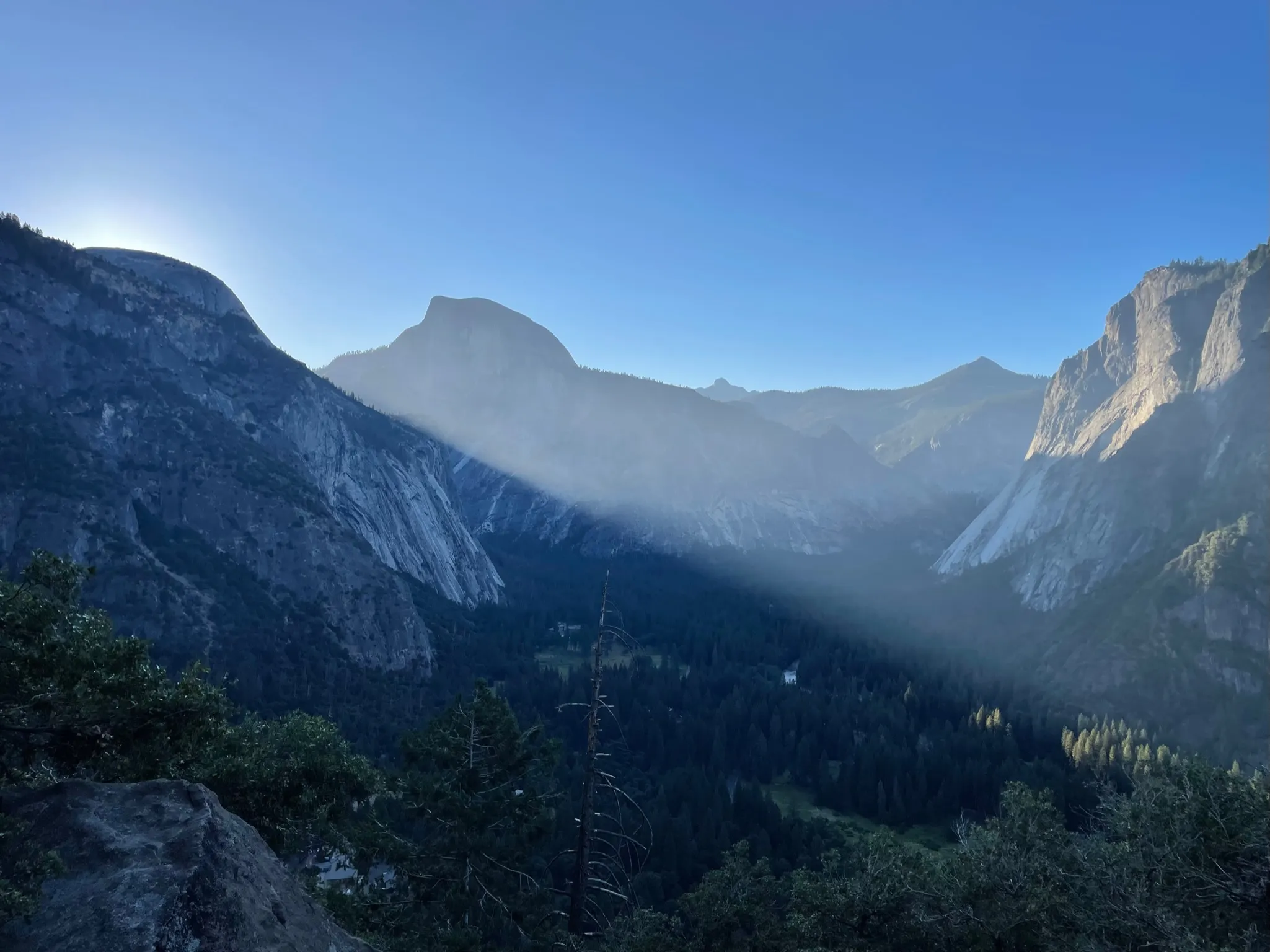 The sun just before appearing over the valley walls.