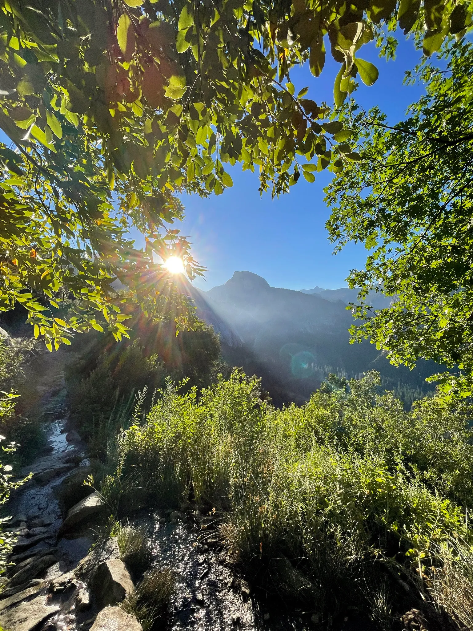 The sun peaks over the valley walls.