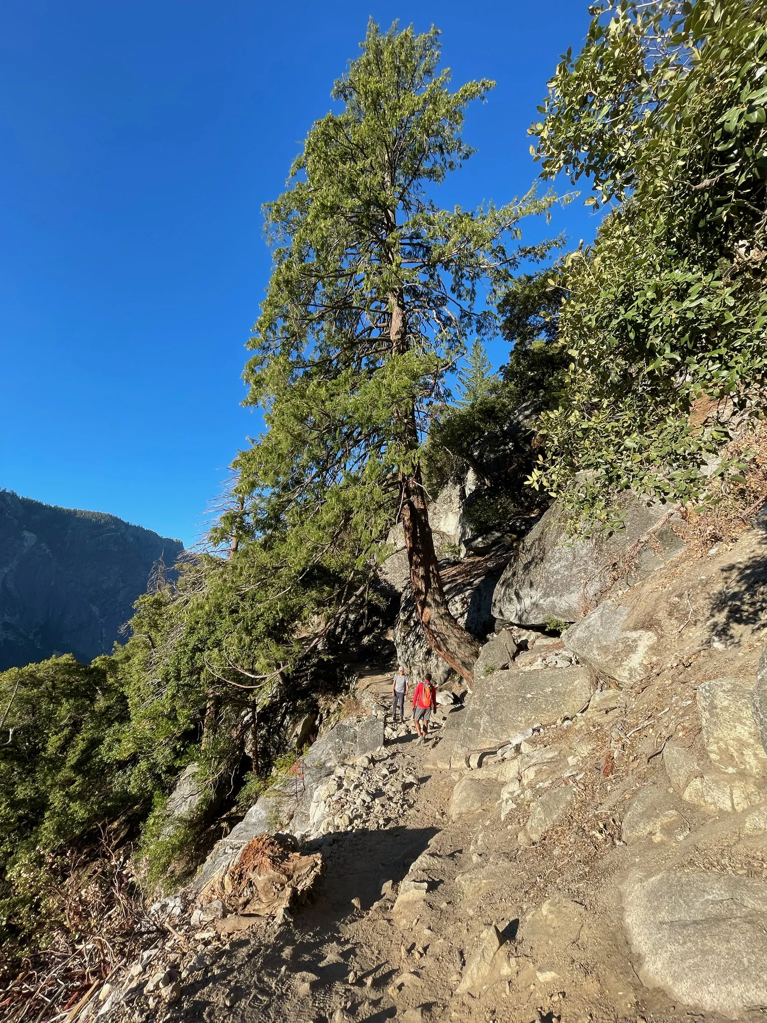 Andi talking to an older man on the trail.
