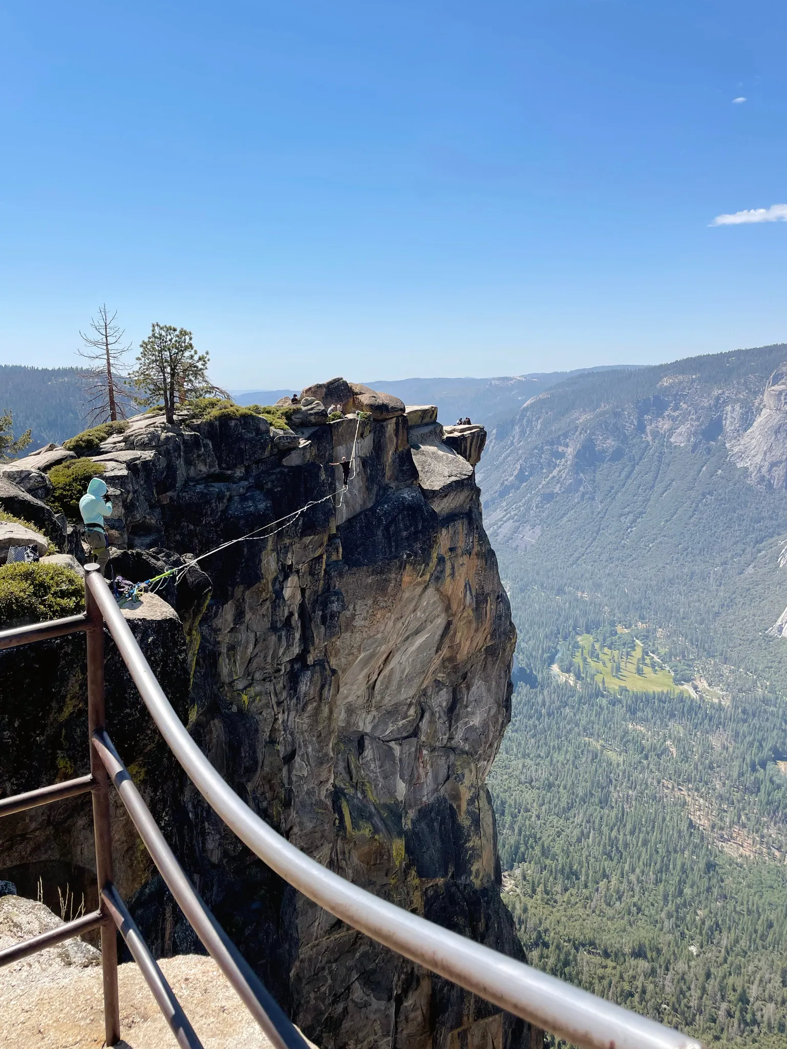 Someone walking a slackline at Taft Point.