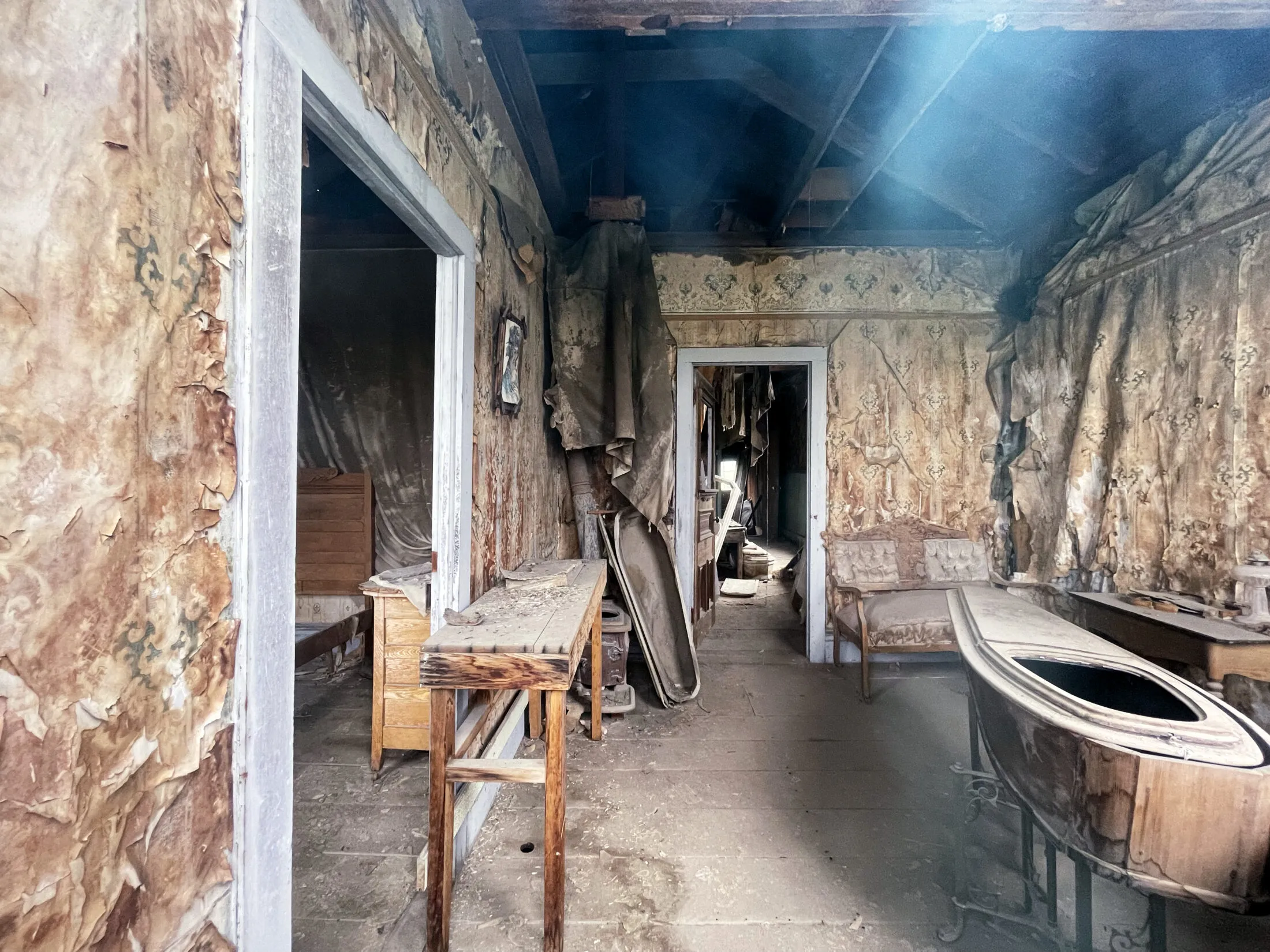 An old funeral home with caskets.