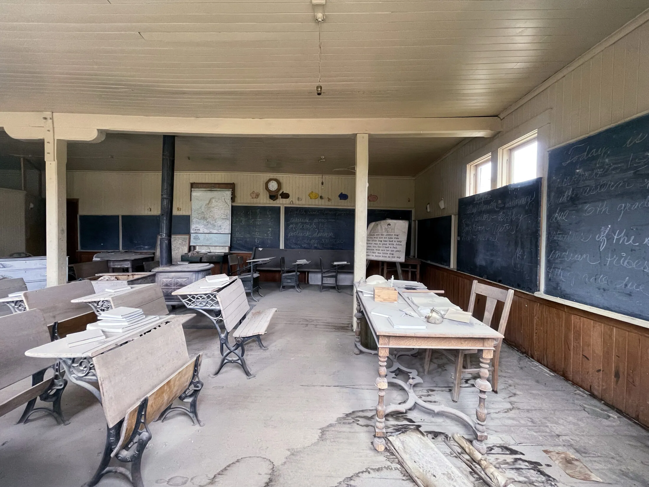Teacher and student desks in an old schoolhouse.
