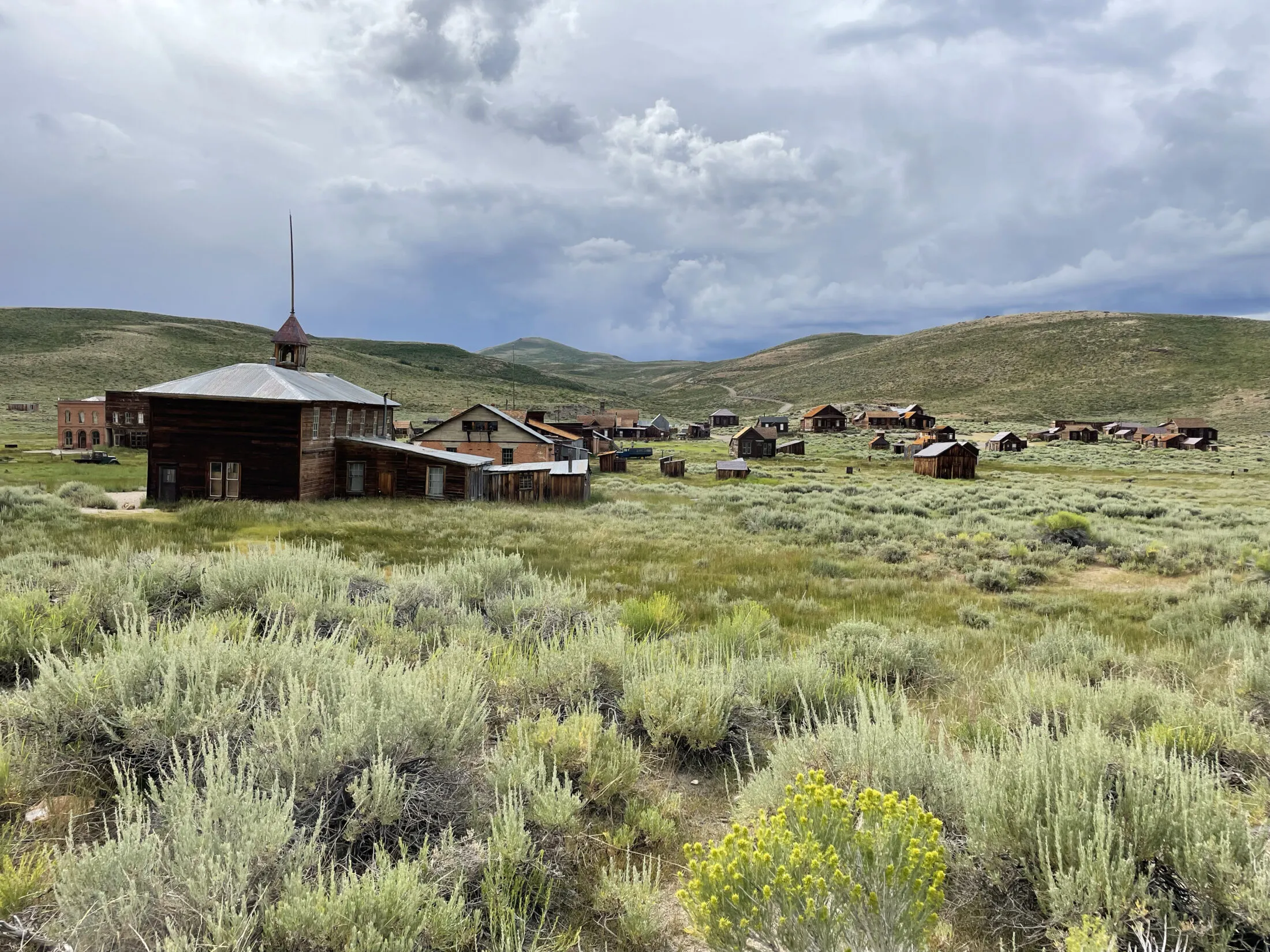 The schoolhouse with the rest of Bodie behind it.
