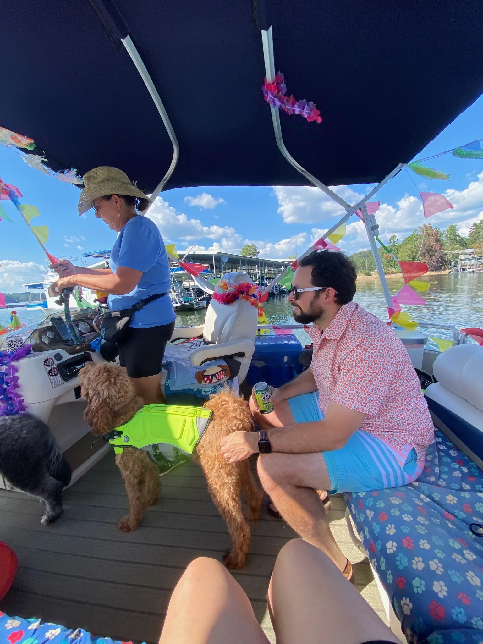 Sam sits on the back of the boat.