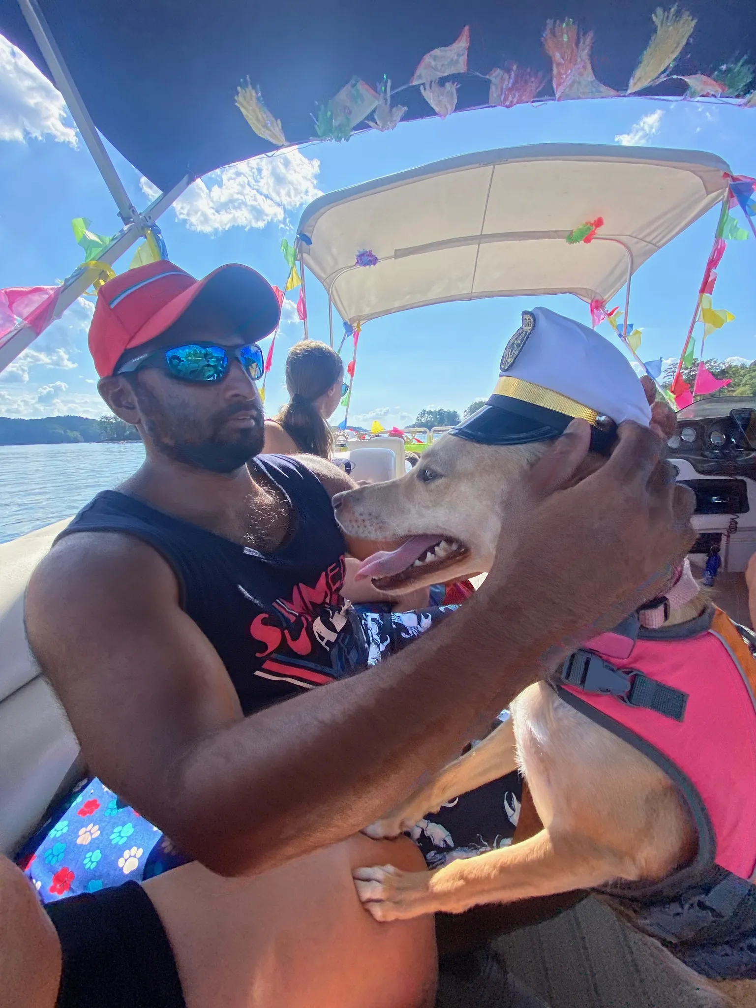 Luna with a captains hat.Andy holds her.