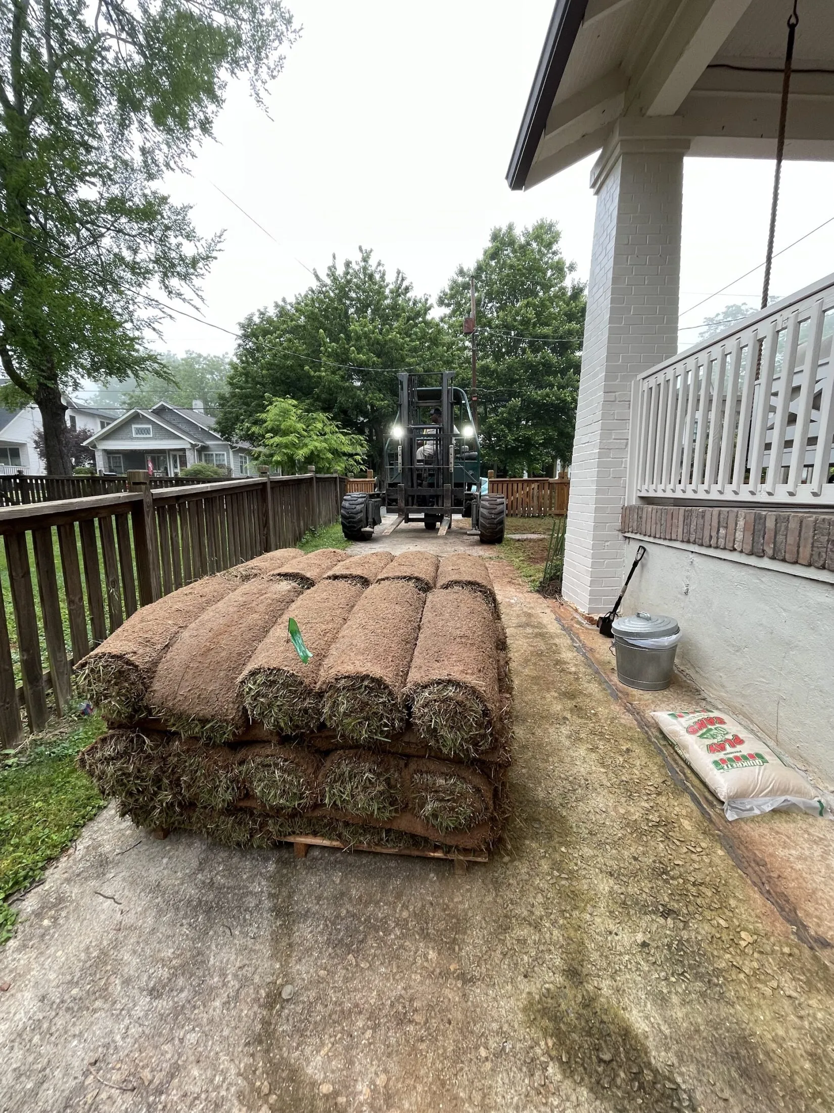 Forklift dropping of sod in my driveway.