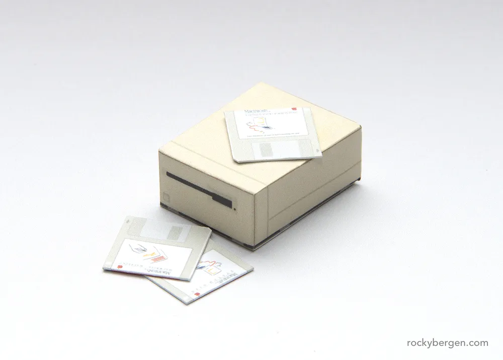 Paper APPLE MACINTOSH 128K floppy drive.
