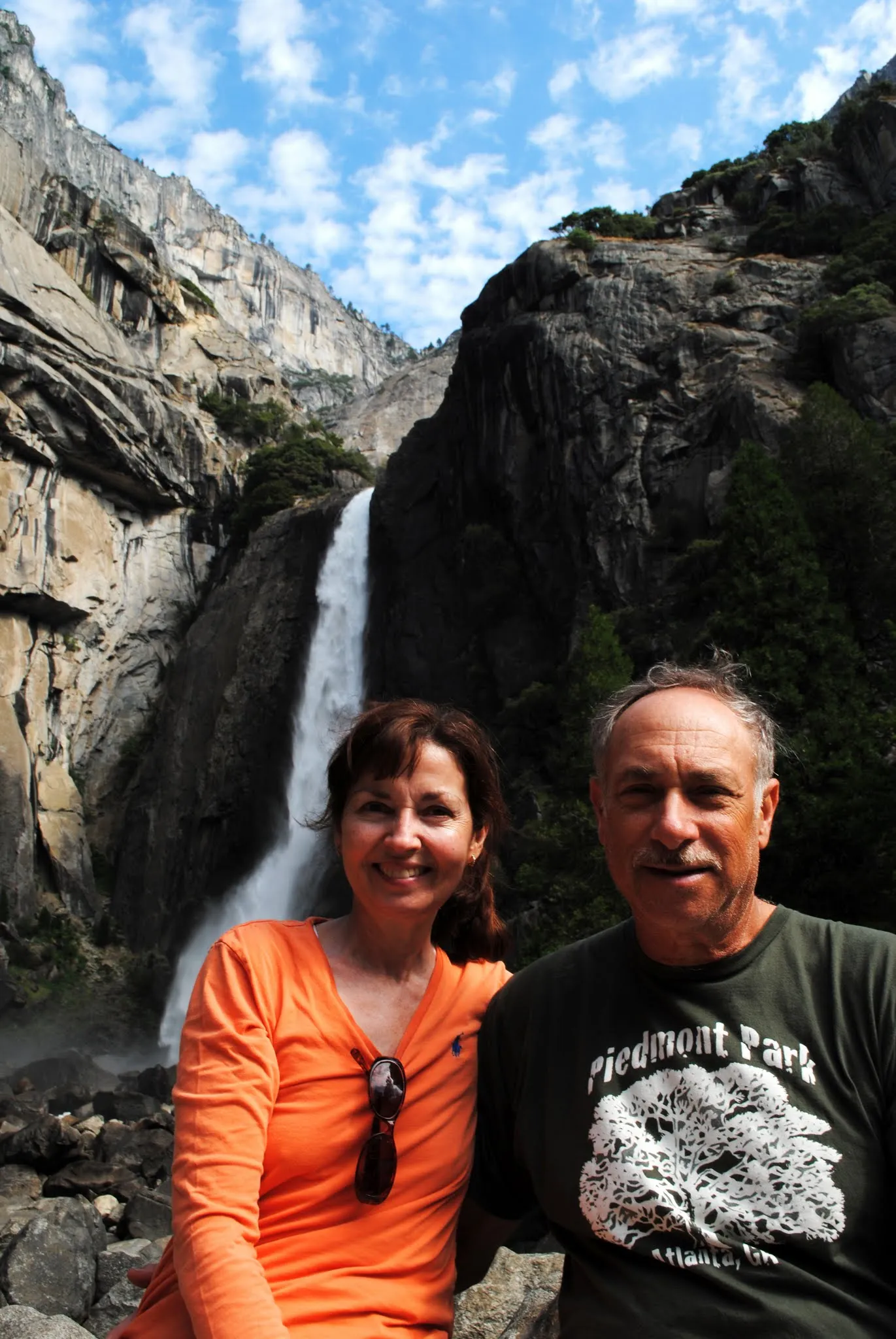Mom and Dad pose in front of Yosemite Falls.