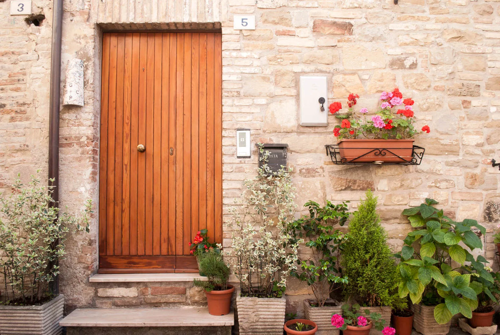 Flower-covered doorway in Bevagna