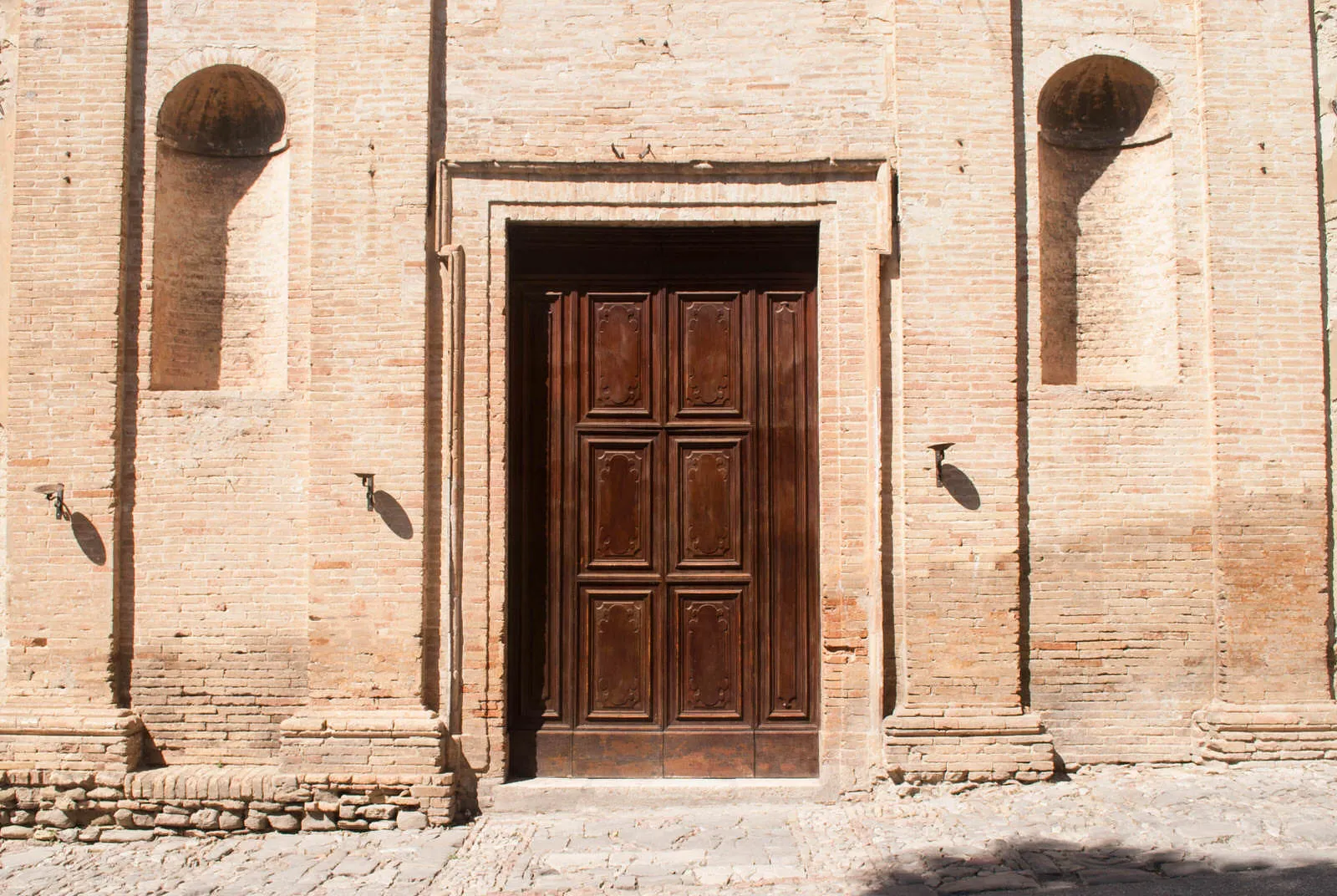 A large, spartan door in Bevagna.