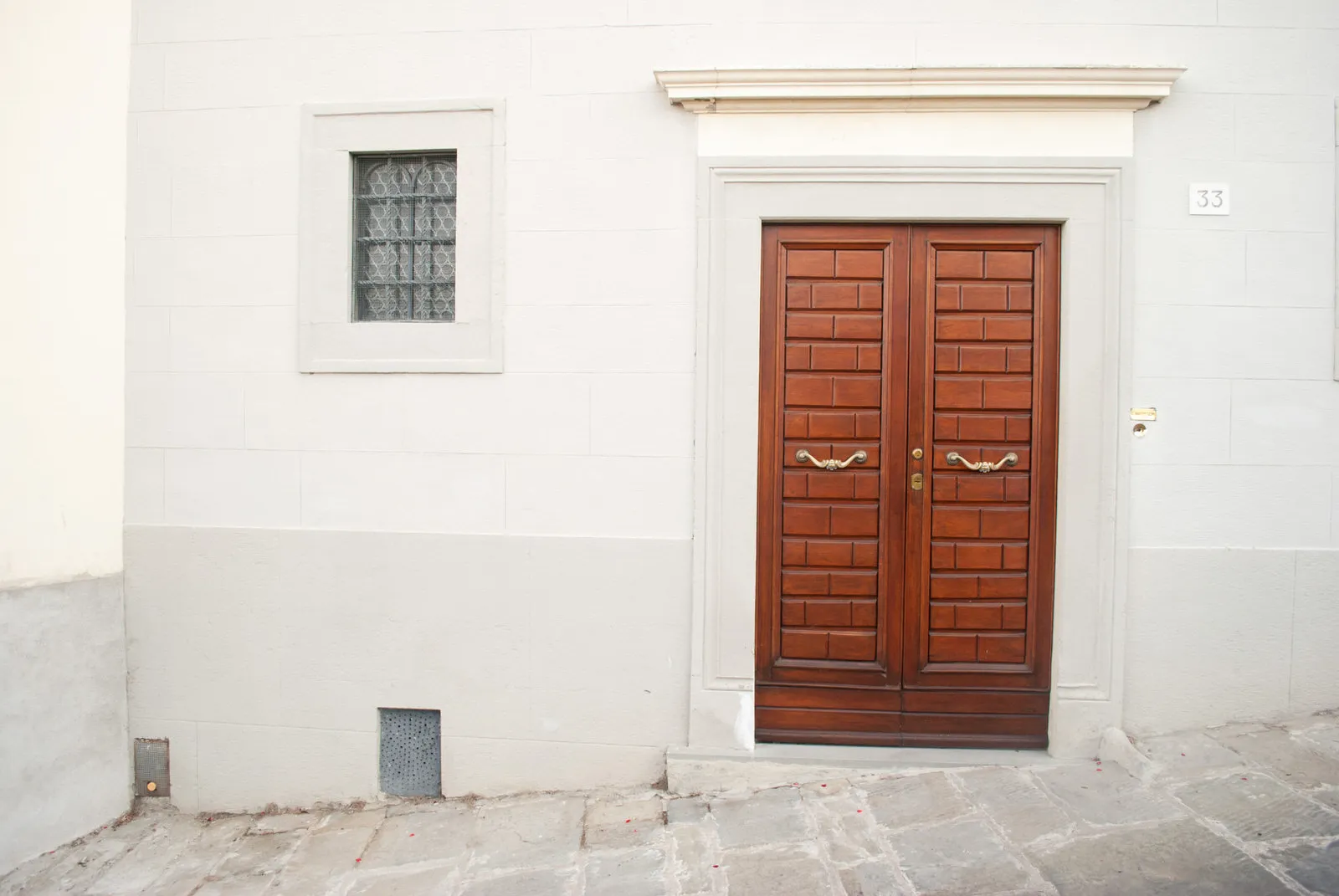 A door against a white wall in Cortona